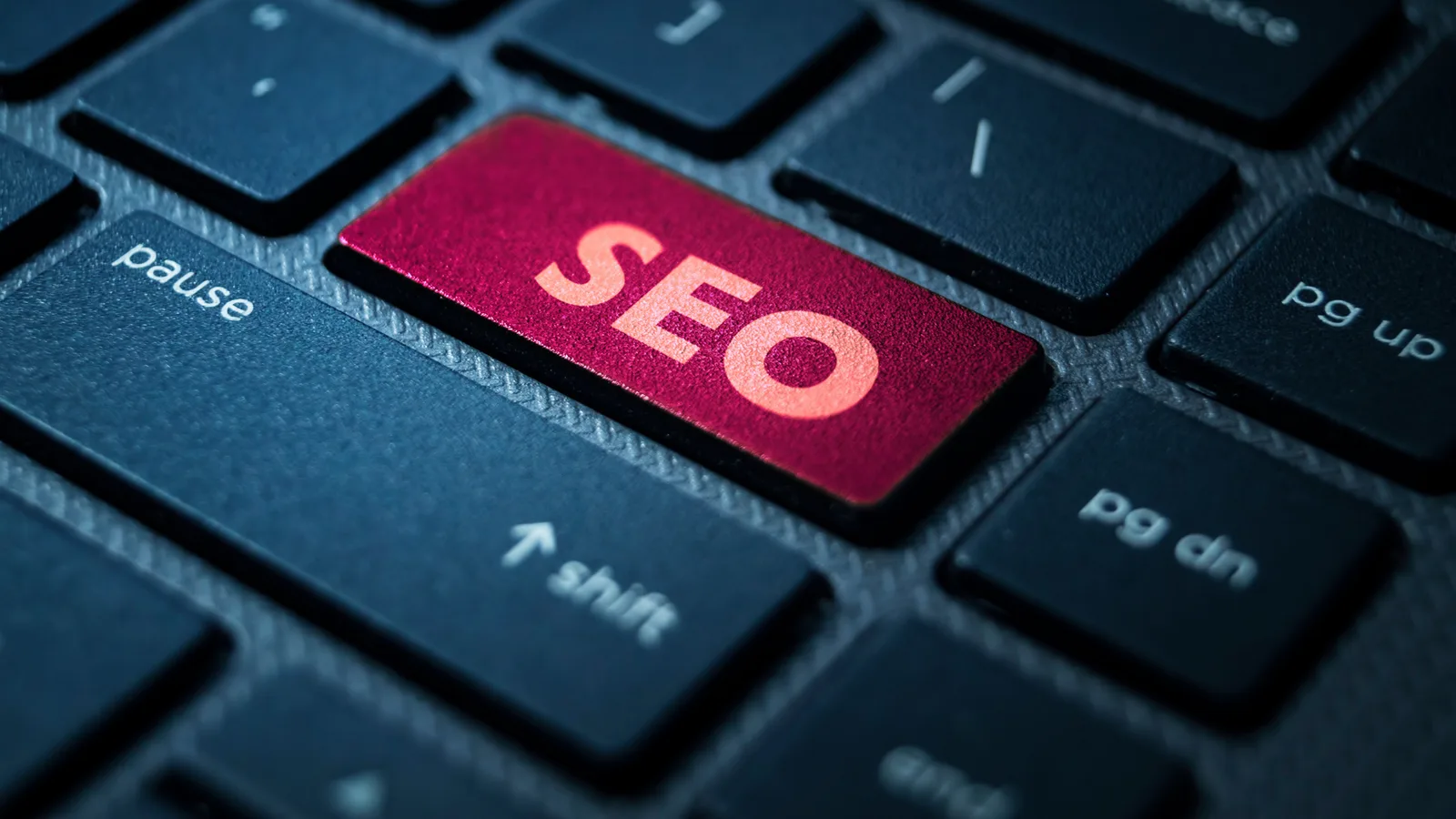 A keyboard with a pink SEO key